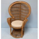 A wicker peacock chair, of typical form and with white, circular cushion, 130cm tall from floor to