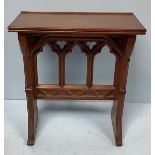 A Gothic revival stained oak church lectern, the base with three pierced arches, 74cm wide