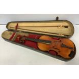A full size violin with two-piece satin wood back, bears label 'Joseph Guarnerius fecit Cremonae