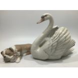 Two assorted Lladro porcelain figures, 'Swan With Wings Spread', number '05231' and 'Unlikely