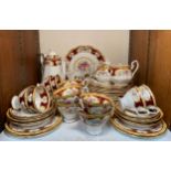 A Royal Albert 'Lady Hamilton' tea service comprising a coffee pot, cake platter, six dinner plates