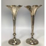 A pair of loaded silver spill vases by Horace Woodward & Co Ltd, hallmarked London, 1901, gross