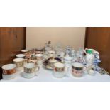 Fourteen various porcelain coffee cans together with a teacup and saucer, blanc de chine style