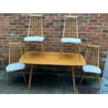 An Ercol blonde beech and elm dining table of rectangular form, raised on squared, tapering