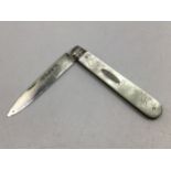 A silver bladed and mother of pearl handled fruit knife, applied oval plaque engraved 'E.A.B',