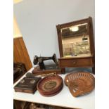 A cast iron tractor seat by Wm Doyle & Co Ltd, together with a roulette wheel, Singer sewing