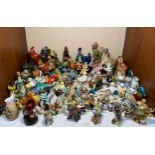 A large quantity of bird figurines including some Beswick examples, bird varieties include
