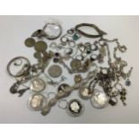 A quantity of silver jewellery including bracelets, rings, necklaces etc. together with two £5 coins