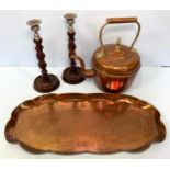 An art nouveau oval copper tray with shaped sides, planished base with continuous floral border,