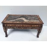 A late 19th century rosewood and mother-of-pearl inlaid low table with pierced and carved sides,