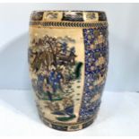 A Chinese pottery cylindrical garden seat decorated panels with scenes of figures and flowers with