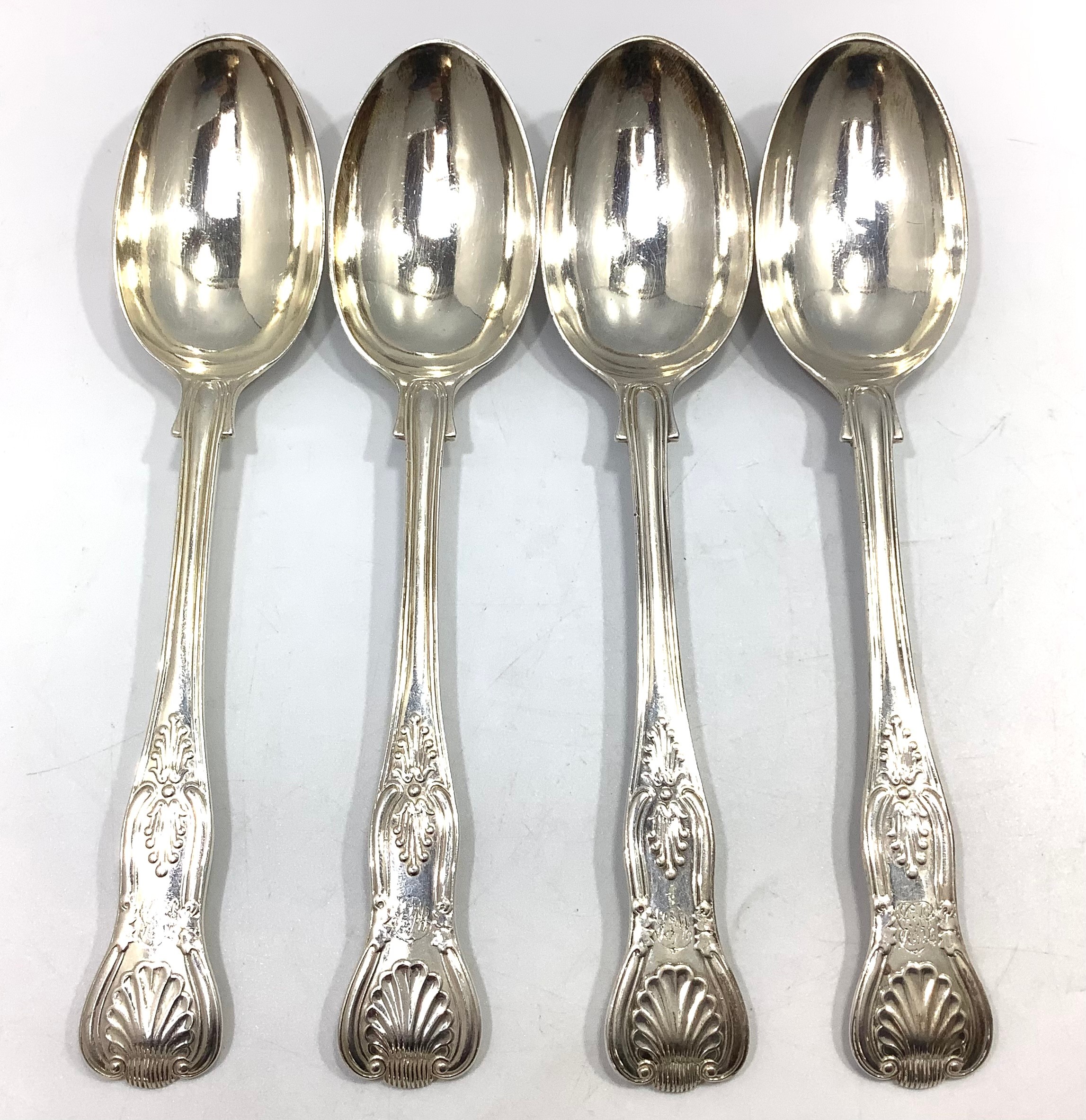 Four large silver Queens pattern serving spoons, London, 1900, maker's mark of Robert Stebbings,