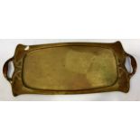 An Art Nouveau, planished brass, two handled tray, of rectangular form, in the manner of Henry Van