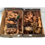 Two large boxes of carved wooden items including carved figures of musicians, oriental style