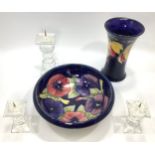 A Moorcroft bowl and vase (both af), together with a three piece Swarovski candle holder set, pair