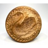 A nicely carved Victorian sycamore butter stamp worked with a swan and recurring trim pattern,