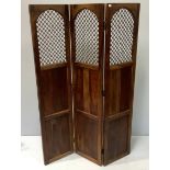 An Eastern stained hardwood three-fold dressing screen with metal grills to the top panels, 175 x