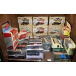 A collection of approximately 30 assorted boxed die-cast model vehicles including examples by