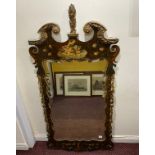 A 19th century Italian pier glass mirror, with fret-cut and carved frame painted with flowers and