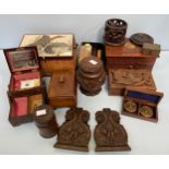 A quantity of wooden jewellery caskets, boxes and covers, book ends and a carved coaster set etc.