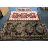 An 'antique' Caucasian hand-knotted tribal rug with a field of guls, and stylised multi floral
