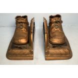 A pair of bronzed and painted metal bookends modelled as children's shoes, 19cm