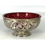 A late Victorian silver bowl by William Hutton & Sons Ltd, the sides pierced and chased with