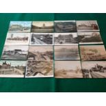 A collection of approximately 38 English and Channel island standard-sized postcards with rail