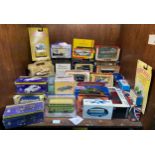 A collection of approximately 40 boxed die-cast model vehicles including Corgi, Lledo and Matchbox