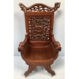 A large Chinese/ French Indochinese carved hardwood X-frame open armchair / throne chair, the high