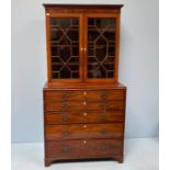 A George III mahogany secretaire bookcase, the top with a pair of astragal doors enclosing