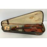 An Edwardian full size violin with paper label 'E Whitmarsh Model London 1910', two piece back
