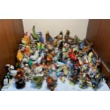 A large quantity of bird figurines including some Beswick examples, bird varieties Goldcrest, Robin,