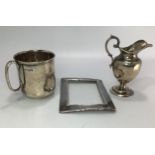 Three assorted silver items comprising a christening cup by Maxfield & Sons Ltd. Hallmarked