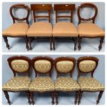 A set of four Victorian walnut balloon back dining chairs with pale green damask upholstered backs