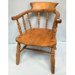 A late 19th/early 20th century beech and elm Captains/Smokers chair by J Elliott & Son, with