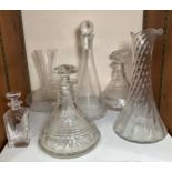 Six various glass decanters and jugs (SECTION 26).