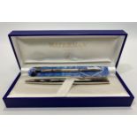 A stainless steel Waterman ballpoint pen, with twist action and spare ink cartridge, in original