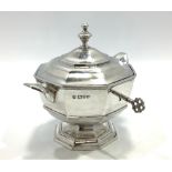 An Edwardian silver tea caddy by George Nathan & Ridley Hayes of octagonal vase form, with finial