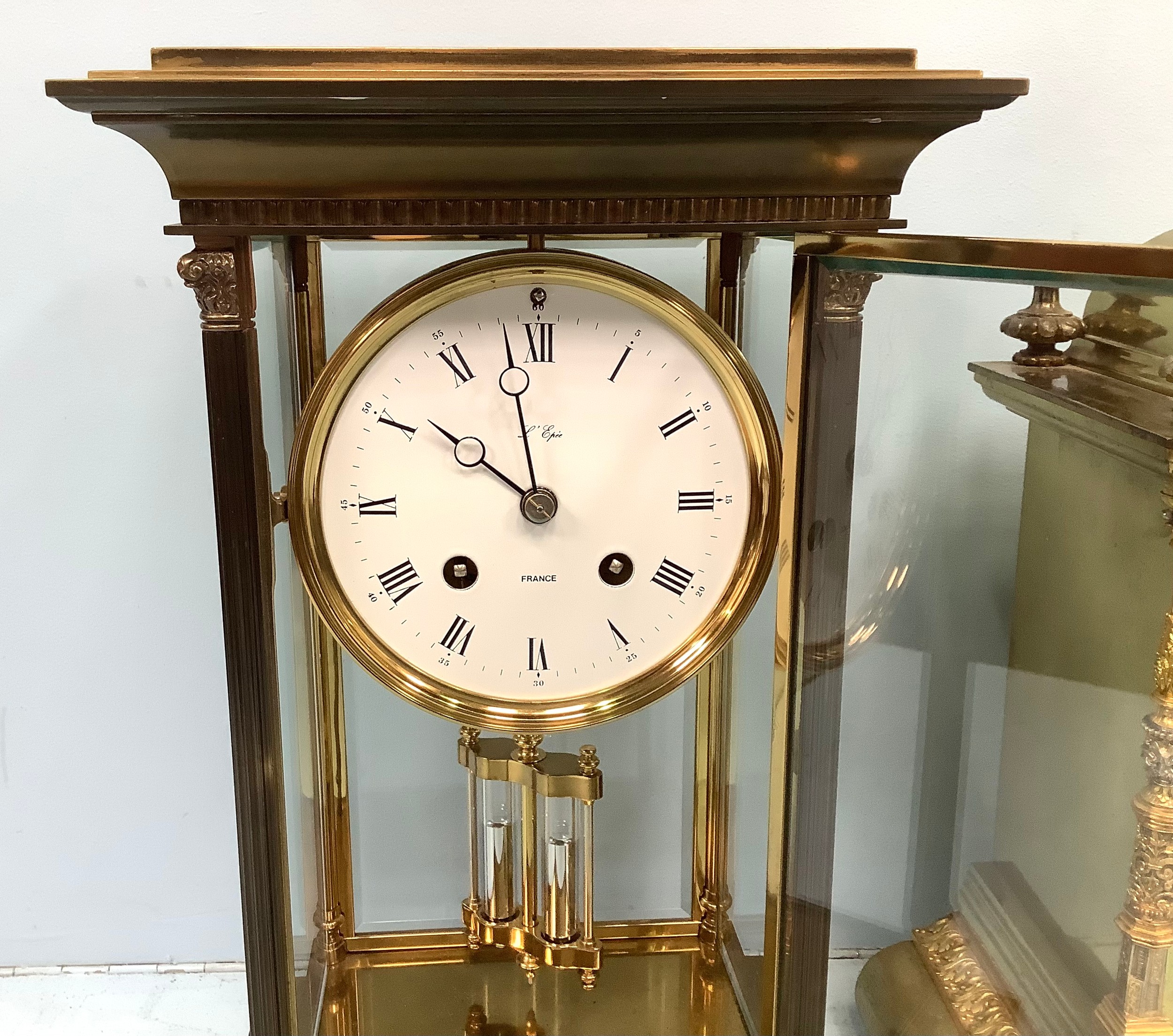 A French brass and four glass mantel clock by L'Epee, the white enamel dial with Roman numerals - Image 2 of 4