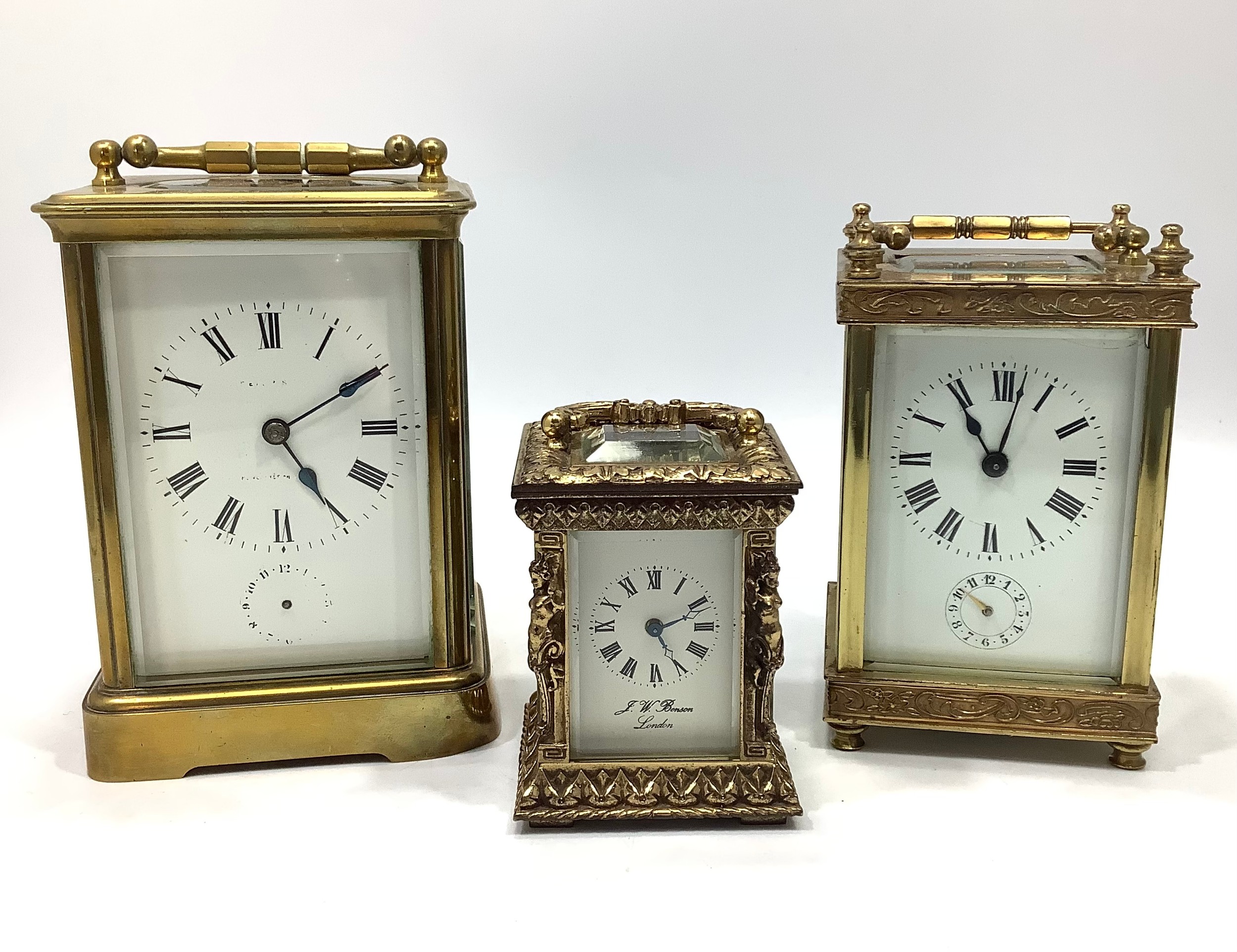 Three assorted brass cased carriage clocks comprising a miniature example by J. W. Benson, London,