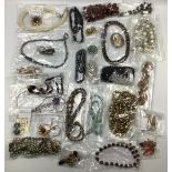 A large selection of assorted costume jewellery, 66 items, including earrings, brooches,
