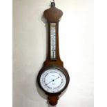 A banjo barometer / thermometer with white enamel dial marked 'T Baird 34 Queen St Glasgow', 76cm