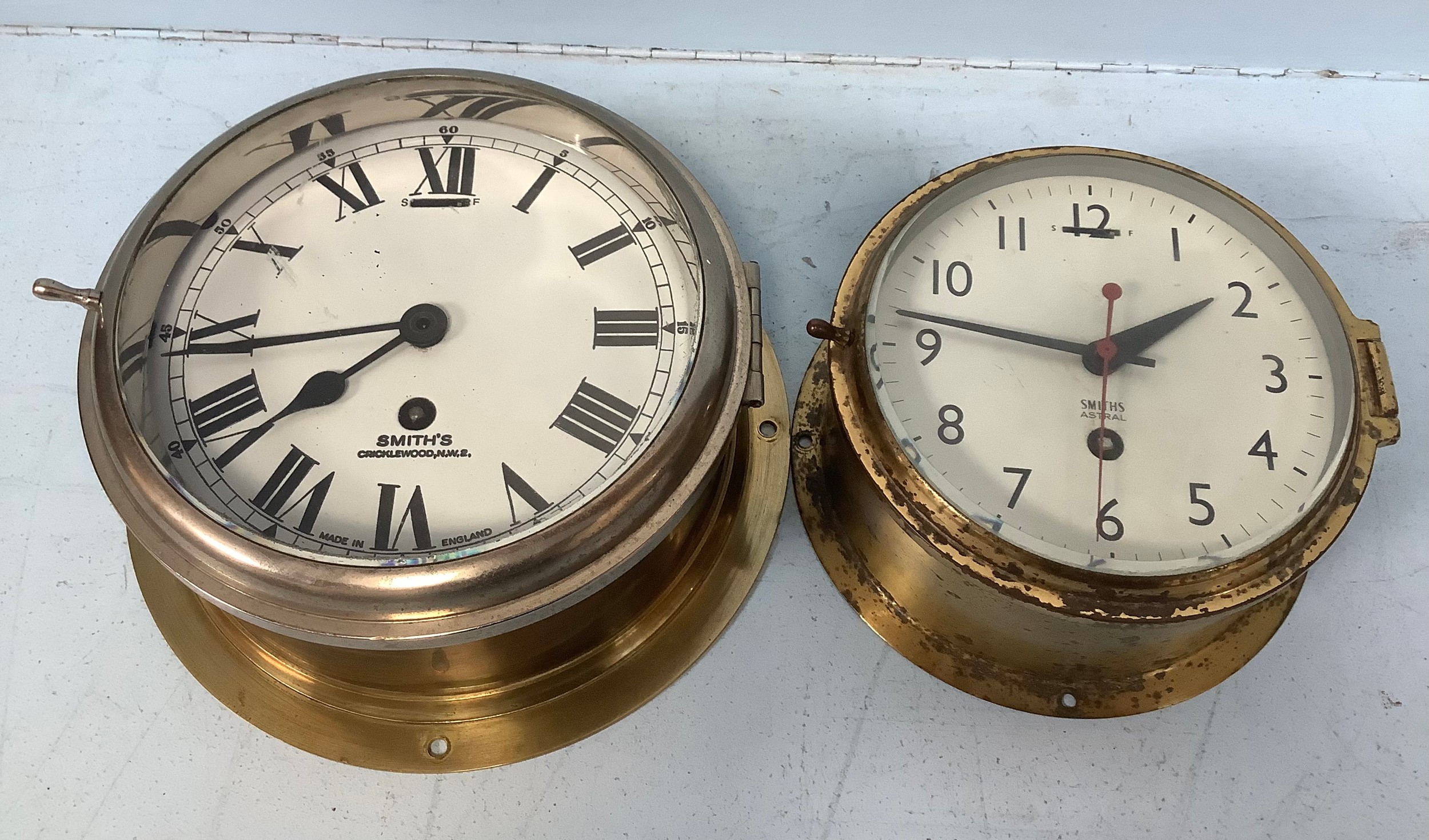 A Smiths of Cricklewood chrome and brass cased bulkhead eight-day clock with hinged front cover