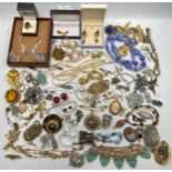 A large selection of silver and metal costume jewellery, approximately 92 x items, consisting of