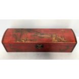 A Chinese red lacquered opium pillow box decorated with mountains and trees, 61cm wide