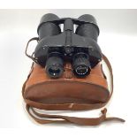 A pair of Kershaw-Vanguard binoculars in brown leather case.