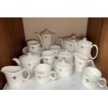 An 18-piece Royal Doulton tea service, of plain white design, with a gilt band and a lion rampant