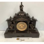 A 19th century black slate mantel clock, modelled as a classical temple surmounted with a figure
