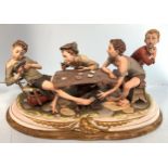 A large Capodimonte porcelain figure group 'The Cheats', depicting three boys playing cards with one